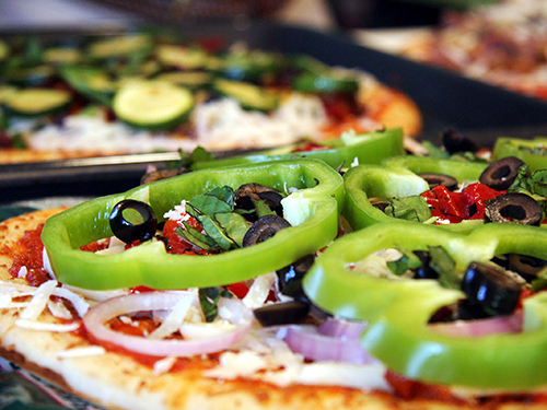 Photo: Pizza with green pepper, black olives, and other healthy toppings.