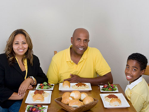 Photo: Family having dinner.