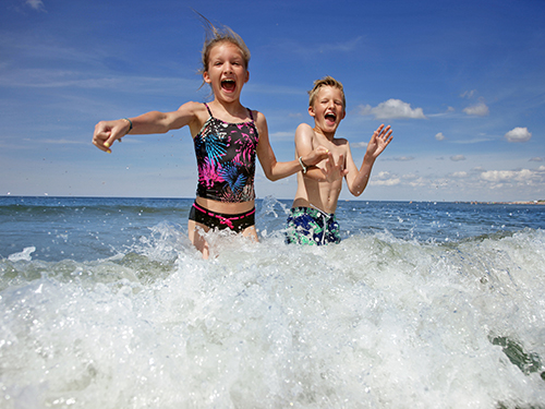 Photo: Children playing in water.