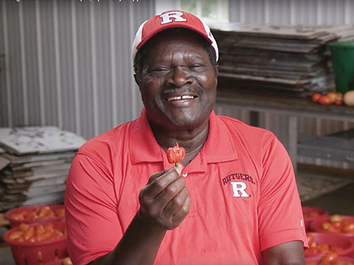 Dr. Albert Ayeni holds up a Carolina Reaper Pepper