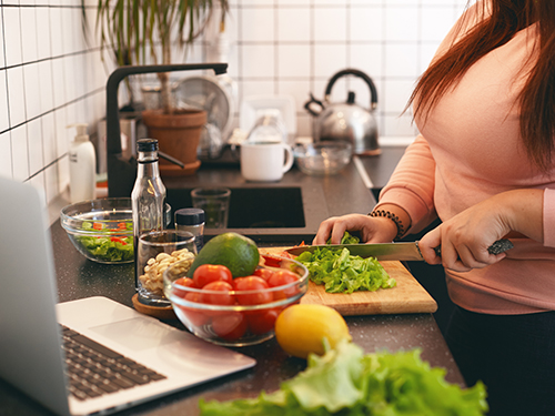 A person preparing healthy food.