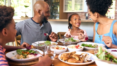 Family eating a meal together.