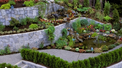 We see a beautifully layered set of retaining walls with wonderful landscaping.