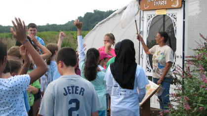 Master Gardener teaches kids at the Butterfly House.