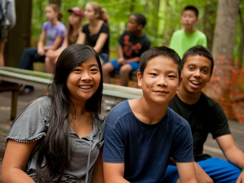 4-H Campers pose for a picture while waiting to use the archery range.