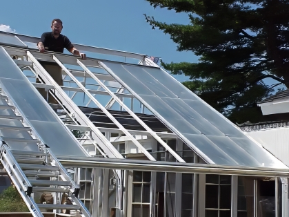 Re-glazing of greenhouse in progress.