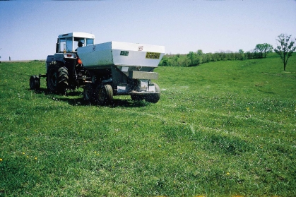 Fertilizing a pasture.